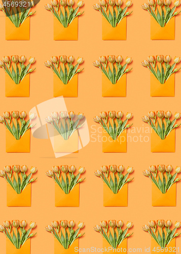 Image of Greeting envelopes pattern with tulip on a yellow background.
