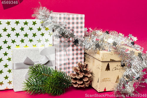 Image of Christmas decoration gift box with pink background