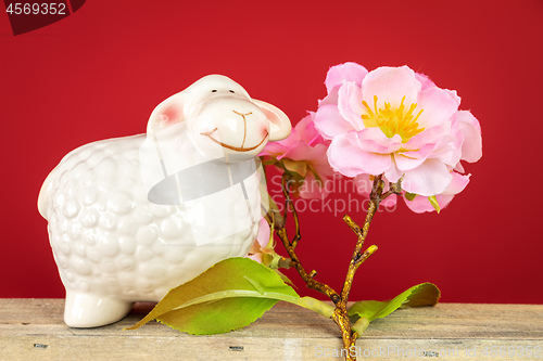 Image of ceramics sheep figure with cherry blossom