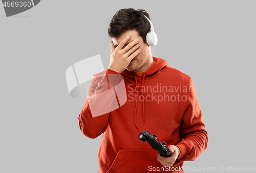 Image of man or gamer with gamepad failed in video game