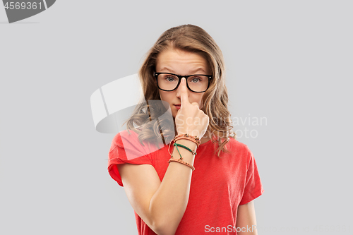 Image of smiling student girl in glasses and red t-shirt