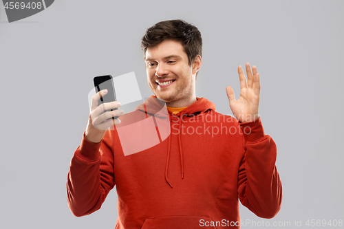 Image of man taking selfie by smartphone or has video call