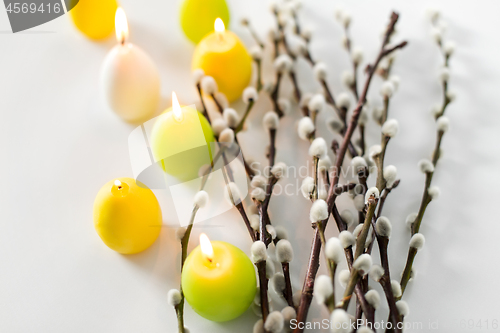 Image of pussy willow branches and easter egg candles