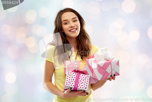 Image of young woman or teenage girl with birthday gifts