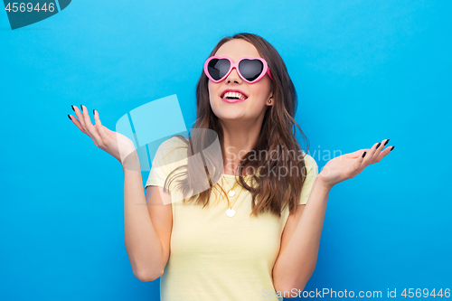 Image of teenage girl in heart-shaped sunglasses