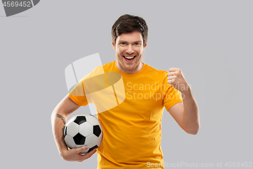 Image of happy man or football fan with soccer ball winning