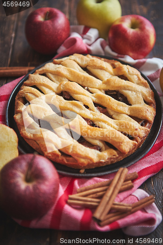 Image of Traditional american apple pie served with fresh fruits