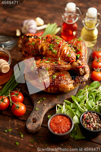 Image of Roasted whole chicken or turkey served with chilli pepers and chive