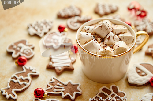 Image of Cup of hot chocolate and Christmas shaped gingerbread cookies