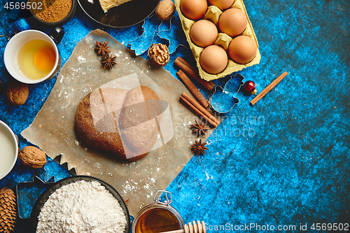 Image of Gingerbread dough placed among various ingredients. Christmas baking concept