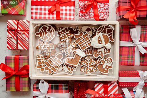 Image of Delicious fresh Christmas decorated gingerbread cookies placed in wooden crate