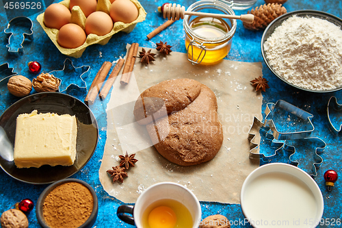 Image of Gingerbread dough placed among various ingredients. Christmas baking concept