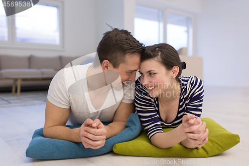 Image of couple lying on the floor at home