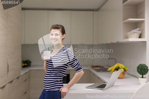 Image of woman drinking coffee enjoying relaxing lifestyle