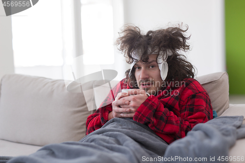 Image of young Man with flu and fever