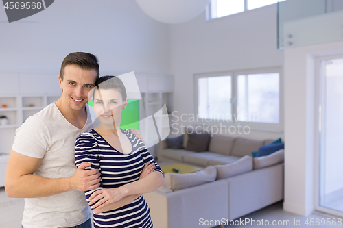 Image of couple hugging in their new home