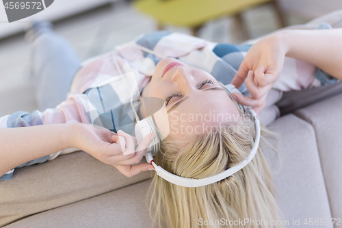 Image of girl enjoying music through headphones