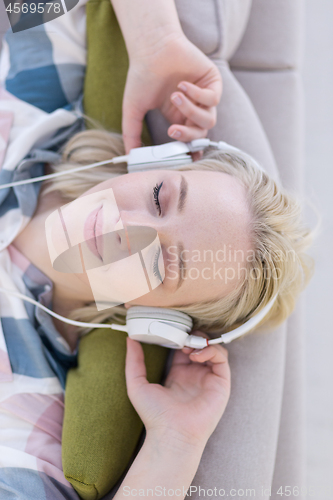 Image of girl enjoying music through headphones