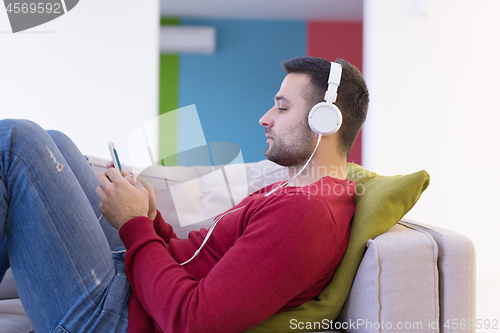 Image of man enjoying music through headphones