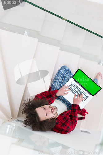 Image of freelancer in bathrobe working from home