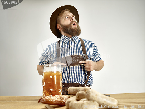 Image of Germany, Bavaria, Upper Bavaria, man with beer dressed in tradit