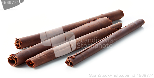 Image of chocolate sticks on white background