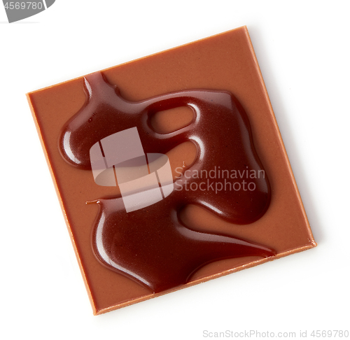 Image of chocolate square decorated with melted chocolate