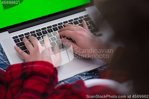 Image of man freelancer in bathrobe working from home