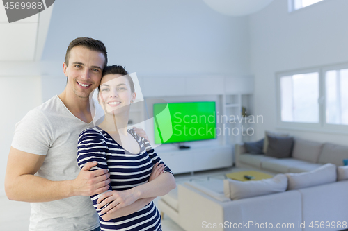 Image of couple hugging in their new home