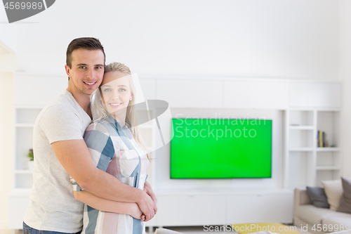 Image of couple hugging in their new home