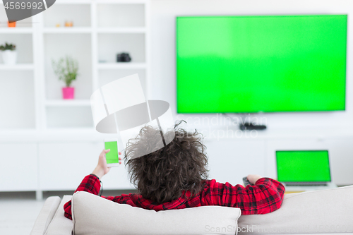 Image of young man in bathrobe enjoying free time