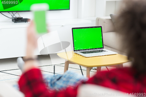 Image of young man in bathrobe enjoying free time