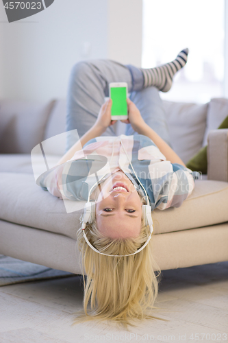 Image of girl enjoying music through headphones