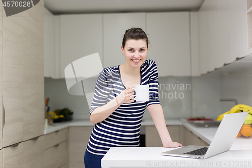 Image of woman drinking coffee enjoying relaxing lifestyle