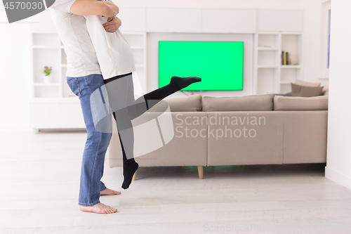 Image of couple hugging in their new home