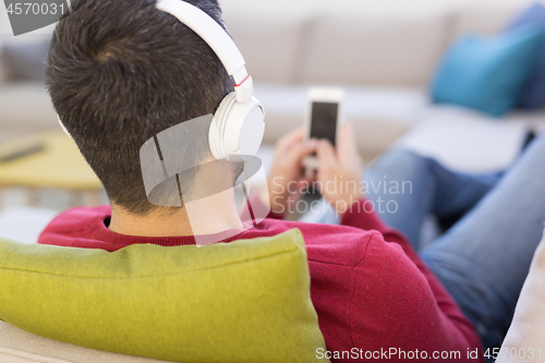 Image of man enjoying music through headphones