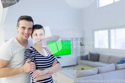 Image of couple hugging in their new home