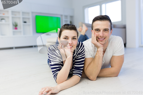 Image of couple lying on the floor at home