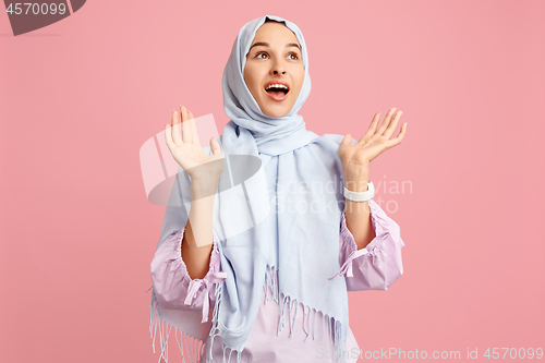 Image of Happy arab woman in hijab. Portrait of smiling girl, posing at studio background