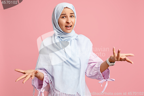 Image of Argue, arguing concept. arab woman in hijab. Portrait of girl, posing at studio background