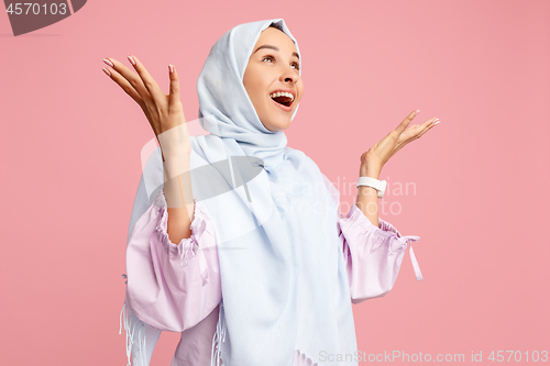 Image of Happy arab woman in hijab. Portrait of smiling girl, posing at studio background