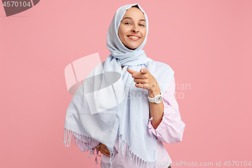 Image of Happy arab woman in hijab. Portrait of smiling girl, posing at studio background