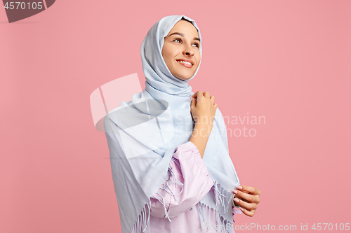 Image of Happy arab woman in hijab. Portrait of smiling girl, posing at studio background