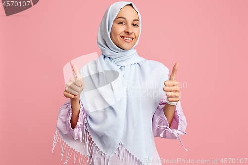 Image of Happy arab woman in hijab. Portrait of smiling girl, posing at studio background