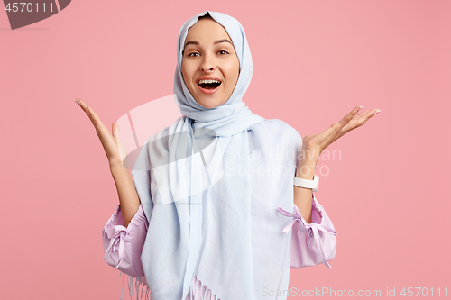 Image of Happy arab woman in hijab. Portrait of smiling girl, posing at studio background