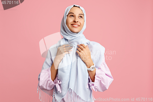Image of Happy arab woman in hijab. Portrait of smiling girl, posing at studio background