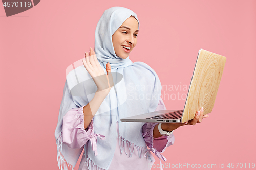 Image of Happy arab woman in hijab. Portrait of smiling girl, posing at studio background