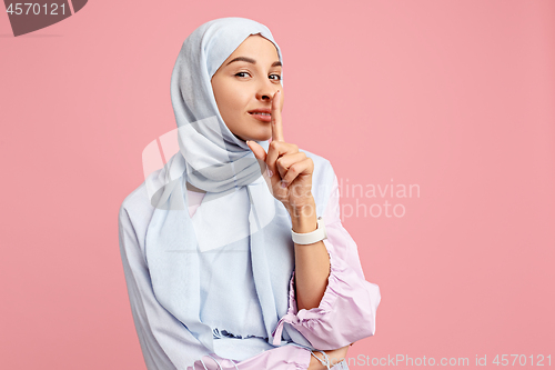 Image of Happy arab woman in hijab. Portrait of smiling girl, posing at studio background