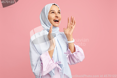 Image of Happy arab woman in hijab. Portrait of smiling girl, posing at studio background