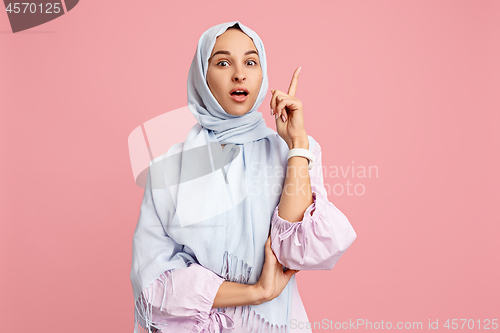 Image of Happy arab woman in hijab. Portrait of smiling girl, posing at studio background
